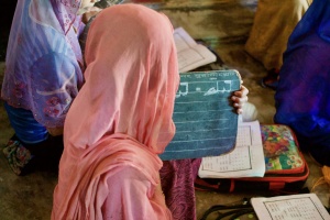 Students practicing to write Rohingya Zuban