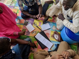 Careers page - Outreach workers from IOM and translators from Translators without Borders work together to conduct comprehension research. Camp in Maiduguri, Borno State, northeast Nigeria. Photo by Eric DeLuca, Translators without Borders.Outreach workers from IOM and translators from Translators without Borders work together to conduct comprehension research. Camp in Maiduguri, Borno State, Nigeria. Photo by Eric DeLuca, Translators without Borders. Kibaku (Chibok) Community Team