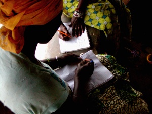 women learning to write community recruitment intern